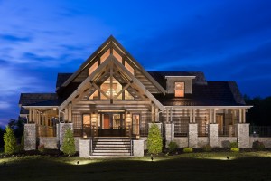 Exterior, horizontal, east elevation at twilight, Cambridge Model, Crossville, Tennessee; Honest Abe Log Homes
