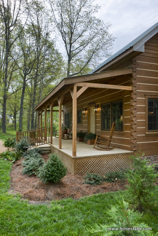 Exterior, vertical, front porch, Clayton residence, Crossville, Tennessee; Honest Abe Log Homes