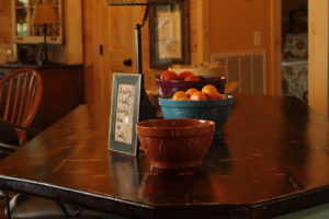 fruit bowls on table in log home