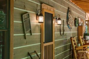 square log home with decorated porch